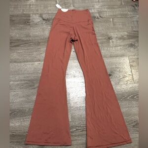 NWT real me hi rise flare leggings. Mauve color